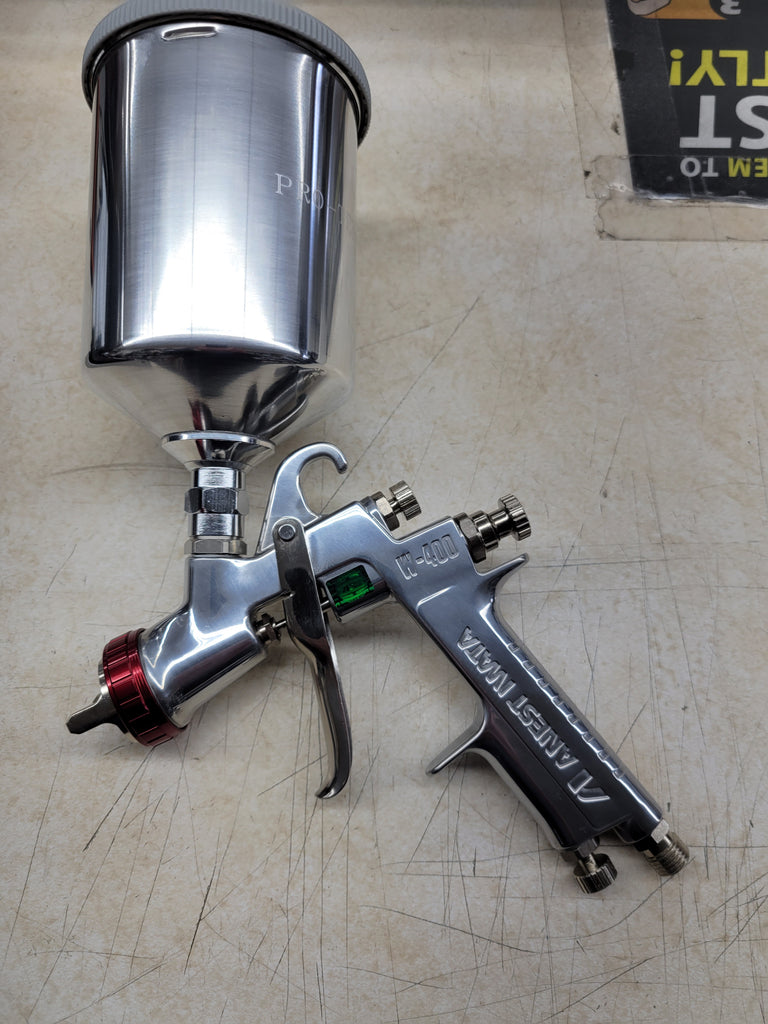Iwata w400 wbx #2113 spray gun. It includes an Iwata regulator